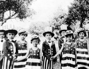 These kindergartners dressed up for the holiday in 1932.  I wish I had had one of those dresses for the party I attended!  Those two girls and guys who were forced to hold hands  aren't pleased about the situation.