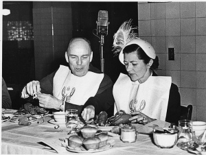 I expect I will be dining like this every night, bib and hat included. Senator Owen Brewster (left) and Ann (Mrs. Oscar) Chapman chow down on seafood at the Maine State Society lobster dinner in the Department of the Interior cafeteria in 1951.